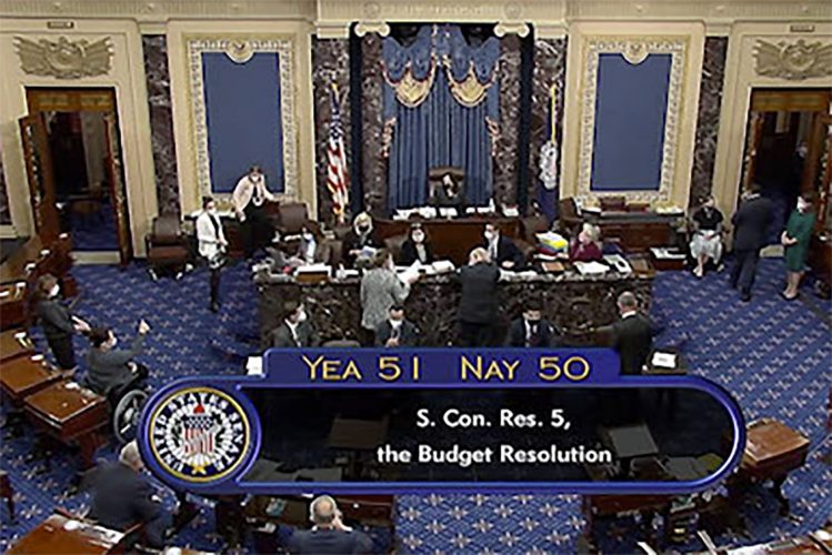 Senate OKs fast-track of COVID aid, Harris casts tie-breaker